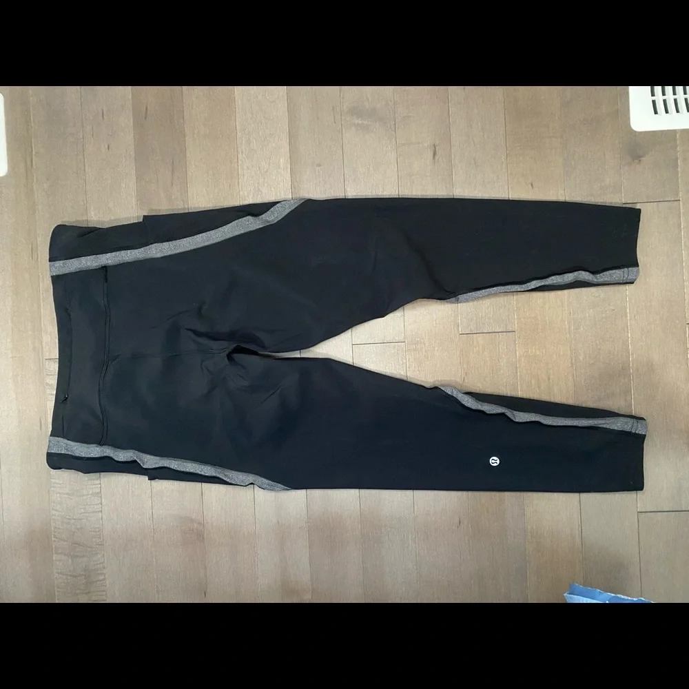Lululemon leggings with side and back pockets. Size 10 black with gray design. - Picture 7 of 9